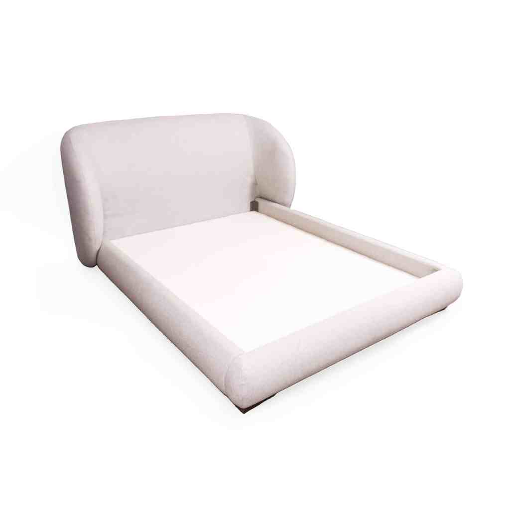 Cama Duna tapizada moderna con diseño curvo y estilo contemporáneo